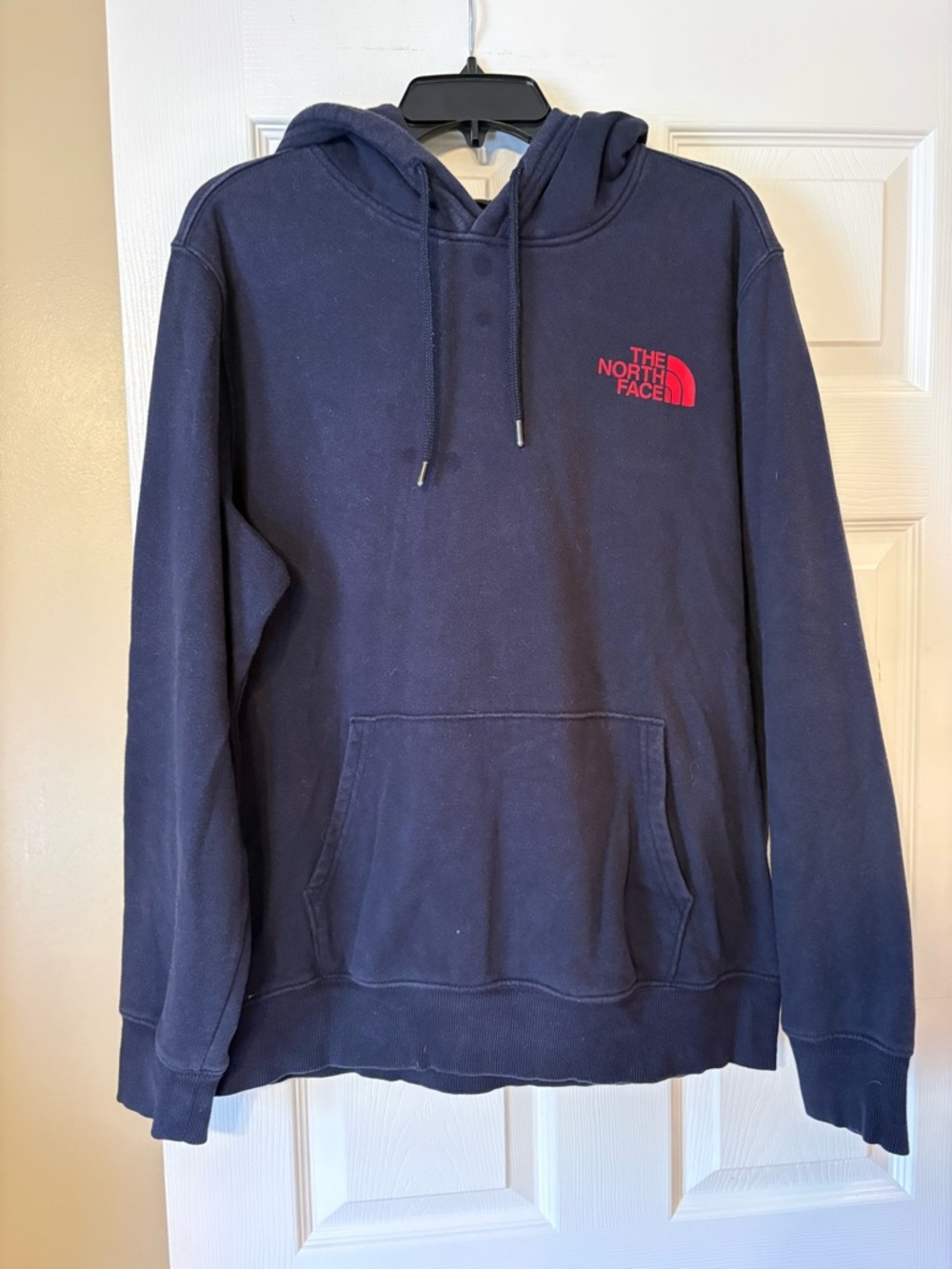 The North Face Dark Blue Pullover Hoodie with Red Logo